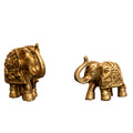 A set of two gold colored polyresin elephant