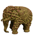 A green polyresin elephant idol with intricate carvings and red accents