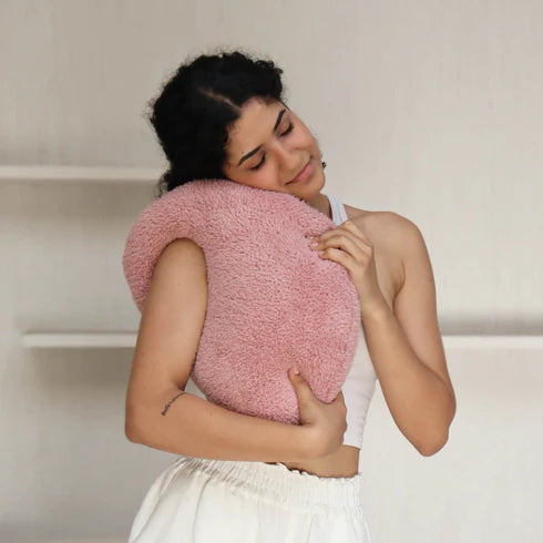 A pink, organic-shaped cushion 