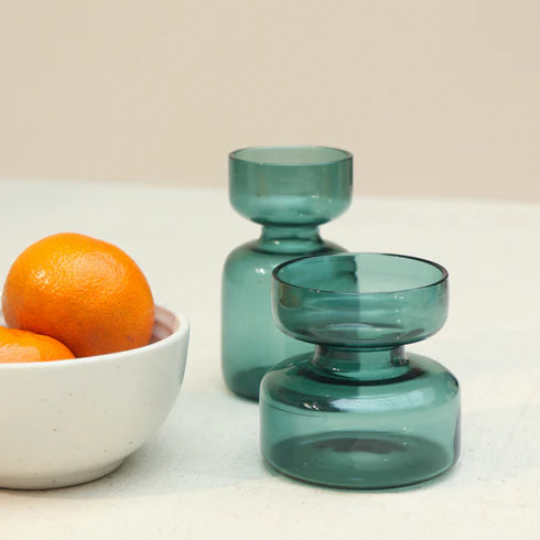 Two moss green glass vases 
