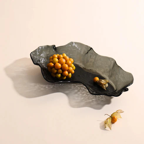 An ash grey glass bowl with irregular shape