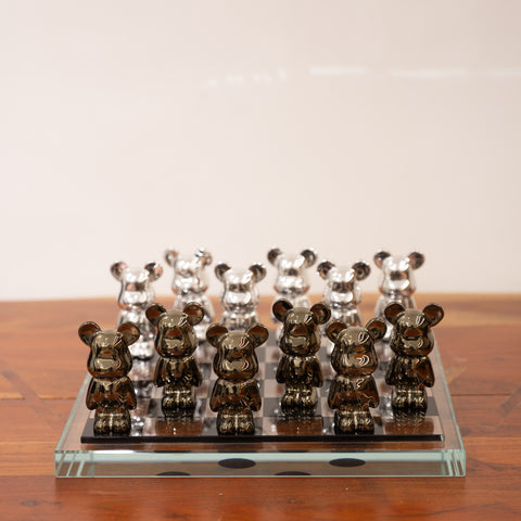 A chess set with pieces resembling bear like structures in brown and grey colors.