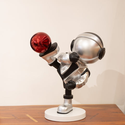 A metallic silver sculpture