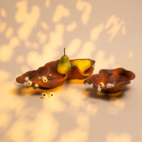 Two terracotta bowls with a floral pattern, one small and one large