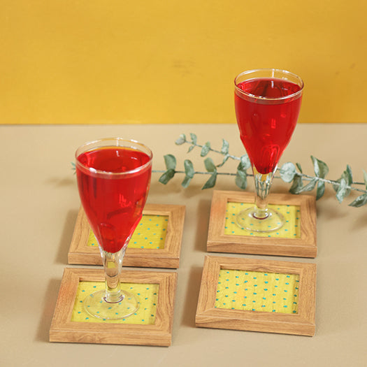 Yellow and blue French knot coasters with glasses